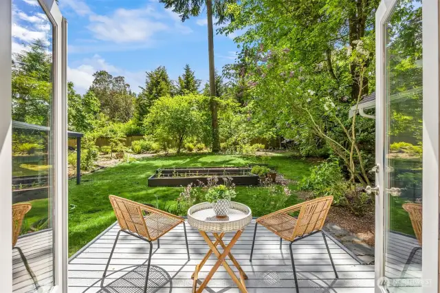 The deck off of the primary suite makes for seamless indoor/outdoor living.