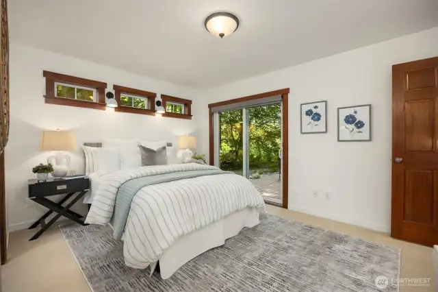 The bedroom enjoys direct access to the back deck.