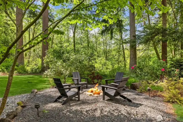 Surrounded by tall evergreens and maples, a wonderful place to entertain under the stars.