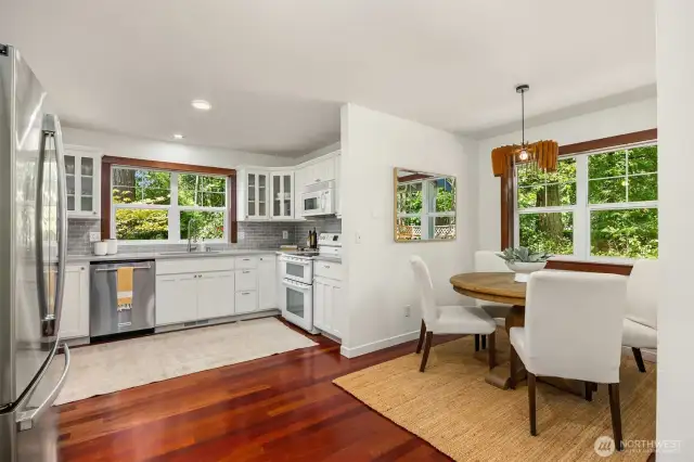 View from the great room to the kitchen and dining.