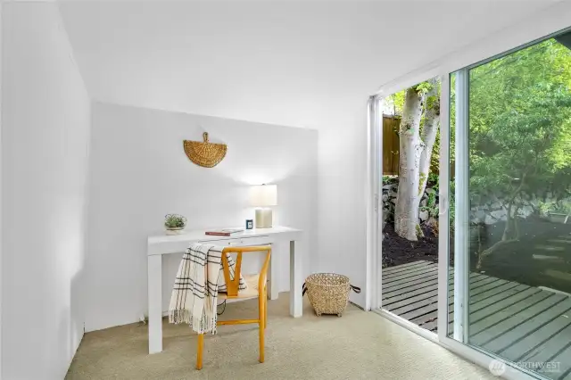Office space off the primary bedroom with a slider to the backyard.