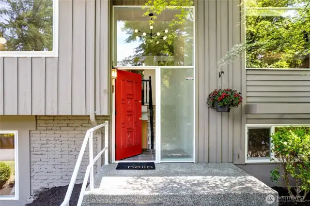 Sunny front entry greets you, with large glass windows to let abundant natural light in.