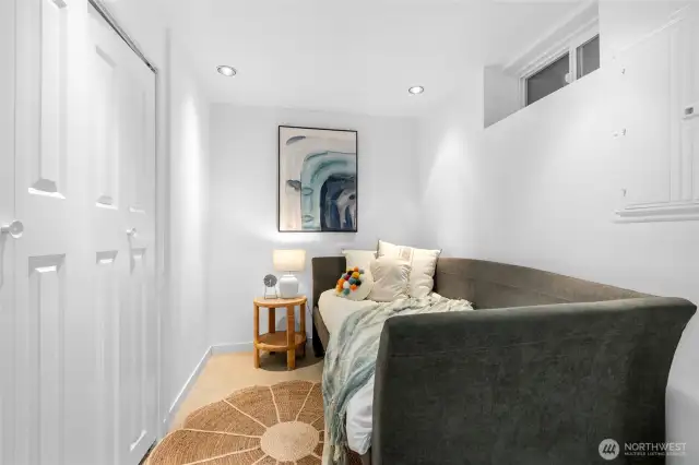 First room off the rec room has a closet and window, could be a guest bedroom, office, or home gym.