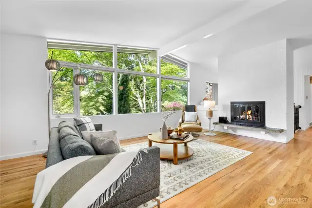Living room features a wood burning fireplace for cozy nights, and a mini-split for cooling to stay comfortable in warm Summer months.