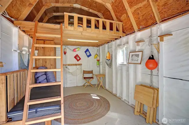 Loaded with character and personality, this mini boathouse (aka shed) is delightful.