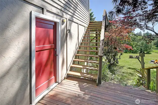 A generous 2 car sized garage with work bench and tools inside the red door. Insulated space with electrical, also the home to the hot water tank, washer, and dryer.