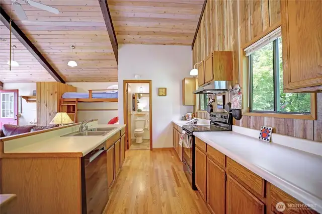 Full size kitchen ready to entertain with brand new dishwasher. Hardwood flooring. Ceiling fan recirculates heat downward making this heating truly efficient and cozy.