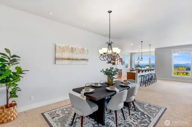 The great room flows seamlessly into this formal dining area and the gourmet kitchen. There's plenty of space here for hosting large gatherings.