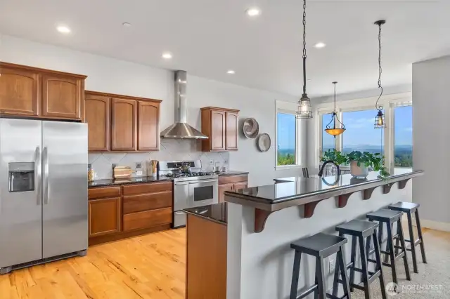 Love the natural hardwood floors, granite counters and abundant recessed lighting...