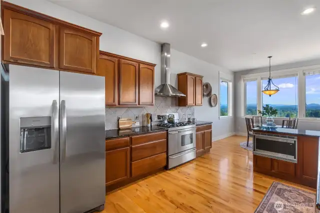 Shiny stainless steel appliances all convey in the sale.  Love the gas range with double ovens, gas cooktop and range hood. Dishwasher and microwave are located at the island reserving counterspace for food prep and presentation.