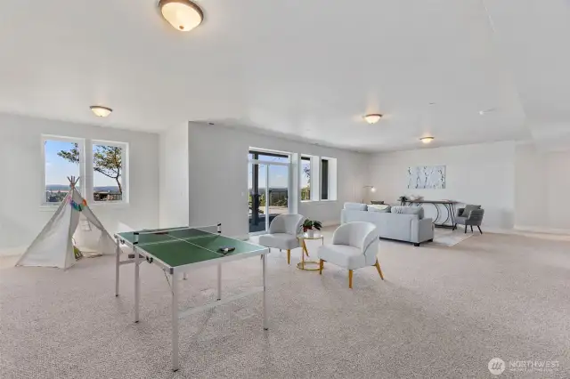 9 foot ceilings, large windows and a slider to covered patio an expansive Trex deck and VIEWS!