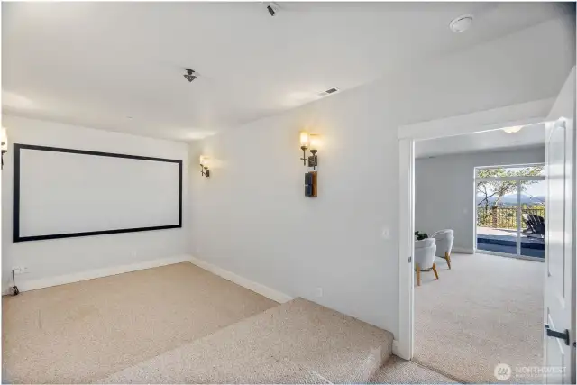 Host the best movie nights or watch game reels with the team in this amazing media room just off the rec room!