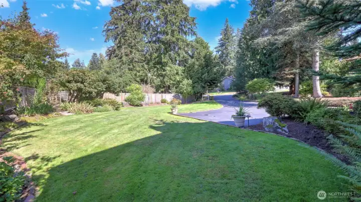 Mature landscaping highlight the front and back yards of this home