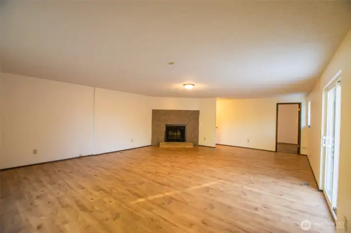 Upper Floor open space w/wood-burning fireplace