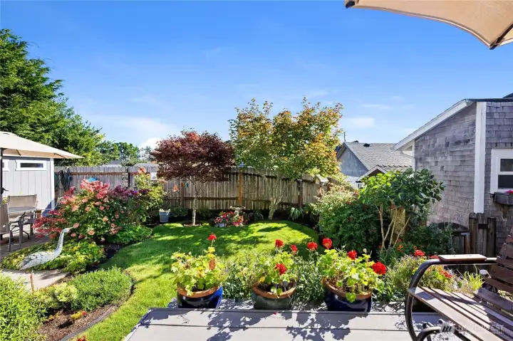 Beautiful landscaped outdoor space just of the deck. Very manageable for those who don't enjoy the yard work.
