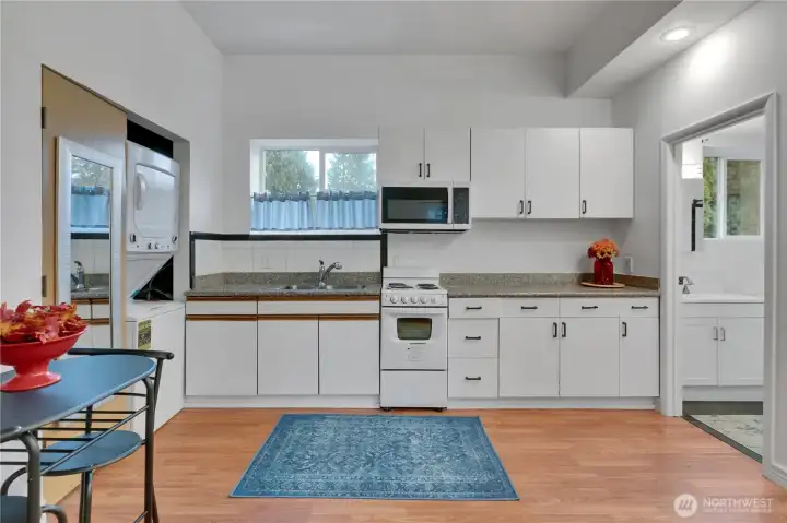 The ADU has an apartment stove and oven plus a microwave and a refrigerator, all stay!