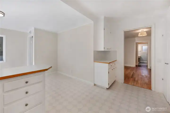 Second view of kitchen with dining room to the right and breakfast nook to the left...