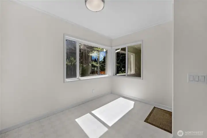 Breakfast nook area with tranquil property views...