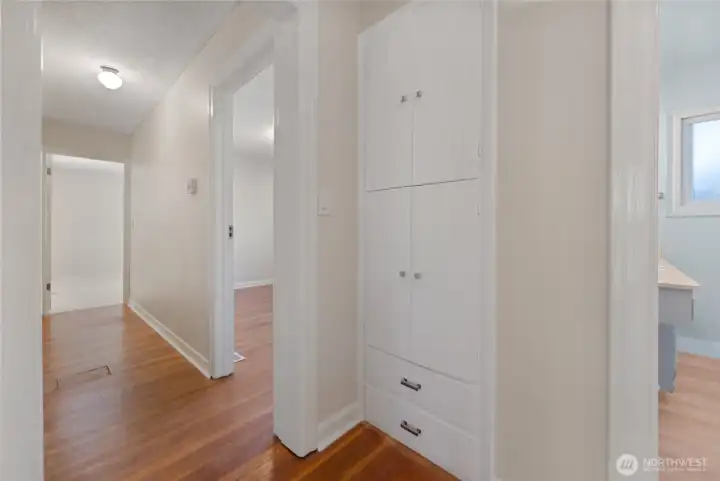 Bedrooms nicely separated on North wing... original built in storage and main bathroom on the right...