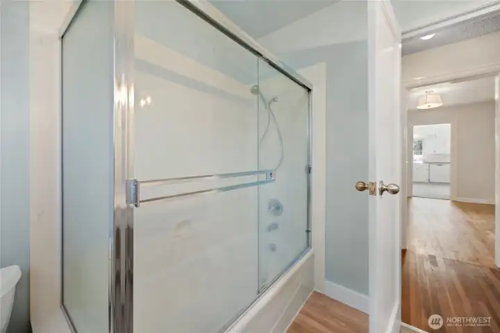 2nd view of main bathroom with nice size tub and shower