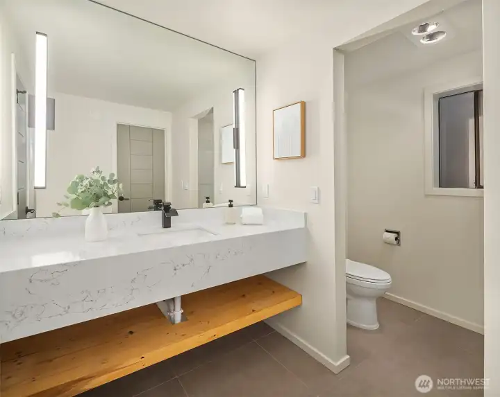 Bath with dual sink vanity in upstairs bonus room/loft.