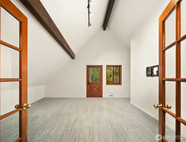 French doors open to the upper level bonus room with flexible options.