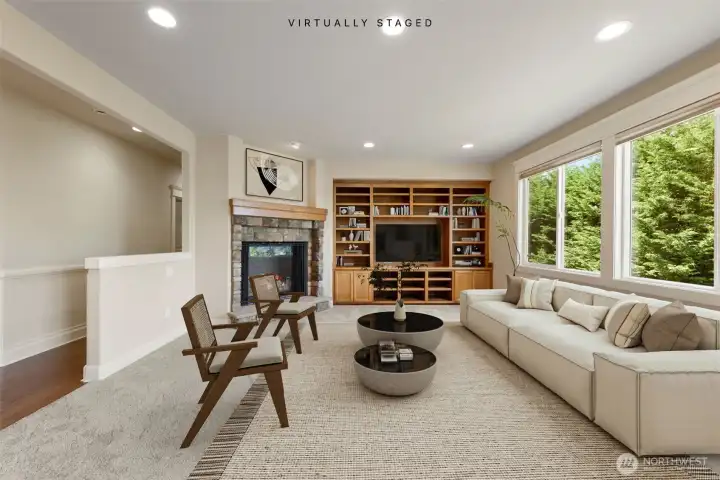 Cozy up in the family room by the fire place! look at the built ins!! (Virtually staged)