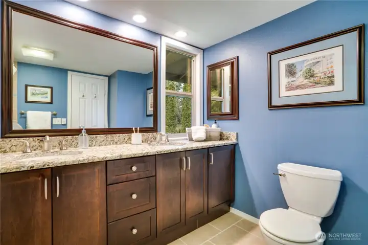 Beautifully remodeled hall bath also has heated tile floors and a soaking tub.