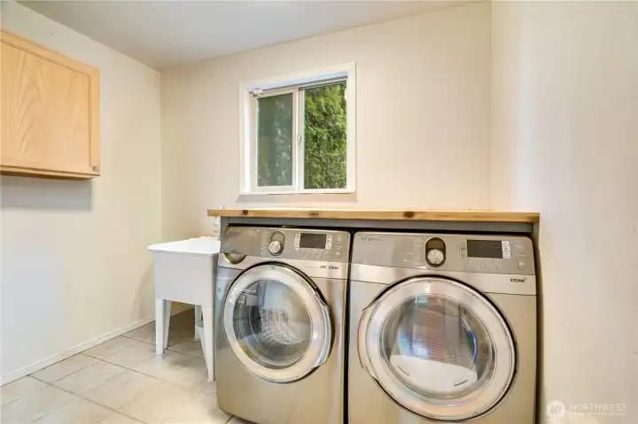 Roomy utility room in lower level.