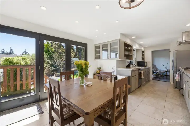 Dining room with sliding doors to deck and yard