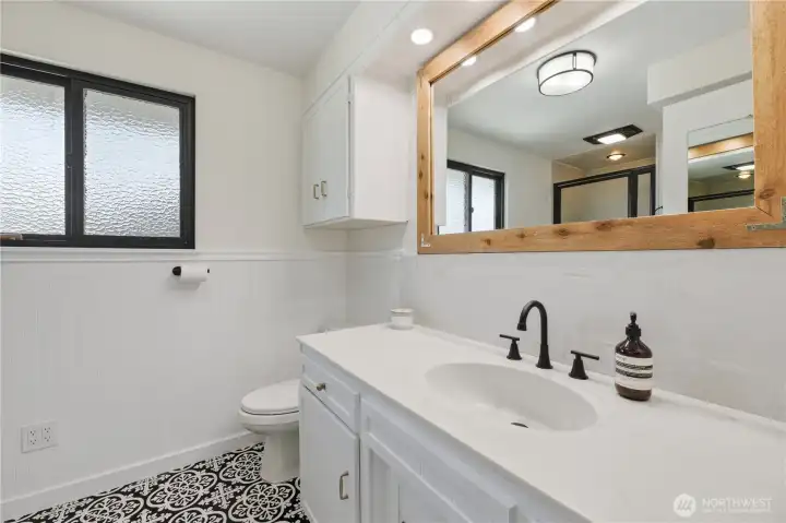 Full bath with separate tub and shower on main level