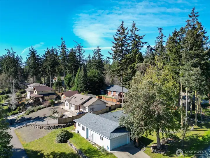 Settle into relaxed single-story living in this cheerful North Beach home, perfectly placed near parks, trails, and shoreline  adventures. Thoughtful updates run throughout the 3-bedroom, 2-bath floor plan, including a new 2025 roof, newer  appliances, and vinyl plank flooring that stands up beautifully to everyday life. Energy-conscious ductless mini-splits  provide efficient heating and cooling, while a freestanding wood stove in the living room adds warmth and character on  cooler days. Wide glass doors draw you out to the sunny, south-facing back deck—a natural extension of the living space for  outdoor dining, container gardening, or simply kicking back in the quiet. The private primary suite opens directly to this  deck as well, making it easy to step outside with your morning coffee or unwind under the stars. An attached two-car  garage, level corner lot with garden space, and available high-speed internet round out a home that is ready for both easy  living and remote work in P