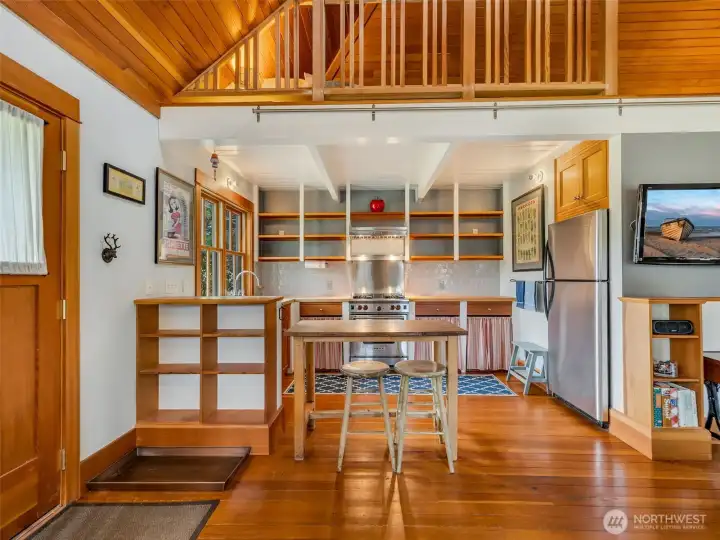 Open living area with custom built-ins and natural light