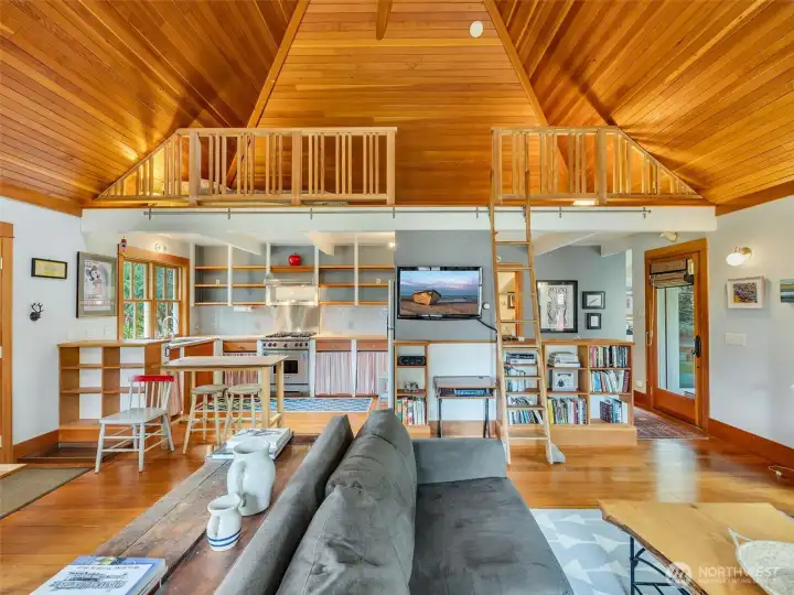 Living space with ladder access to loft
