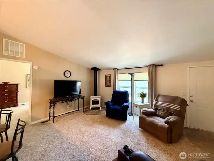 Living room with the Primary suite beyond.