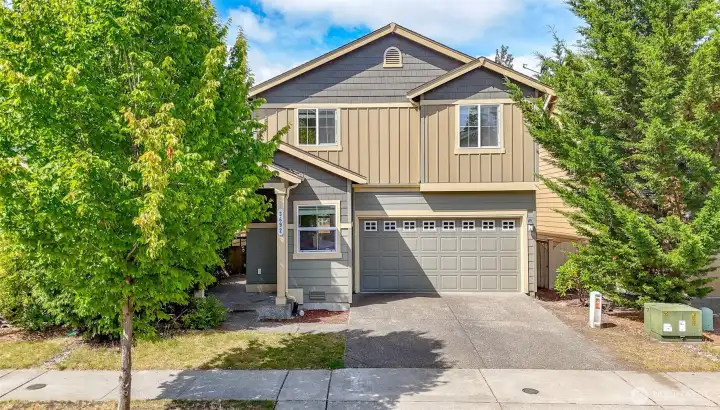 Front Exterior  Attractive two-story home with a welcoming entry, attached two-car garage, and well-maintained landscaping.