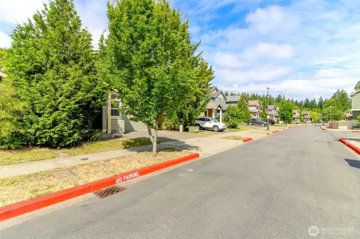 Quiet Neighborhood Street  Located on a quiet residential street in a well-maintained community with sidewalks and attractive neighboring homes.