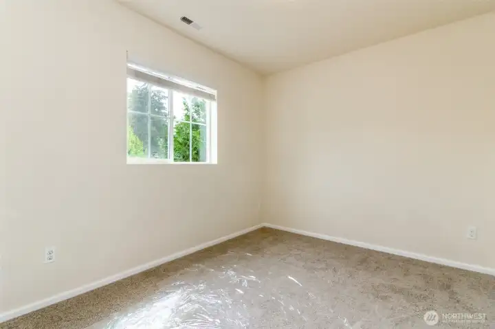 Bedroom 4  Spacious additional bedroom offering natural light and flexible use as a bedroom, office, or hobby room.