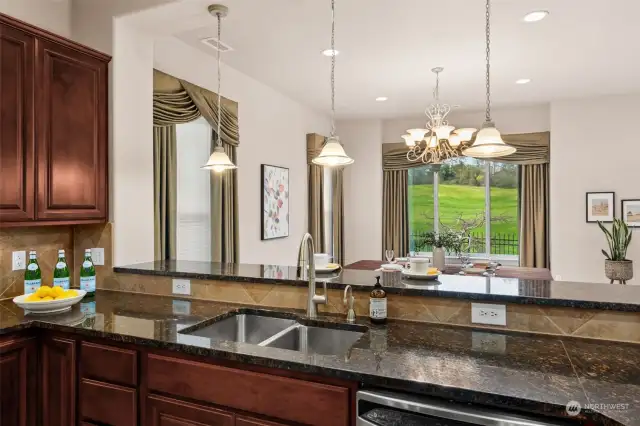 Kitchen is open to the dining room with raised bar.