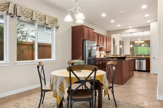 Lovely kitchen nook off kitchen with stunning tile floors. Can be made into a private TV entertainment area as well. Lots of flex room ideas.