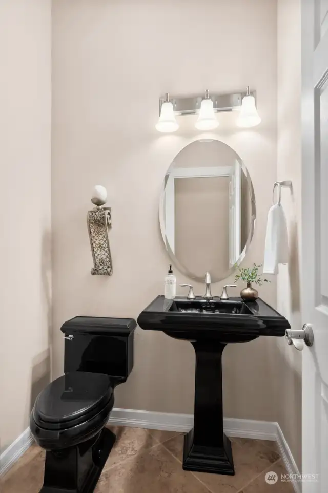 Everyone loves a half bath or powder room for guest and convenience. Located down the hall from the den and laundry room.