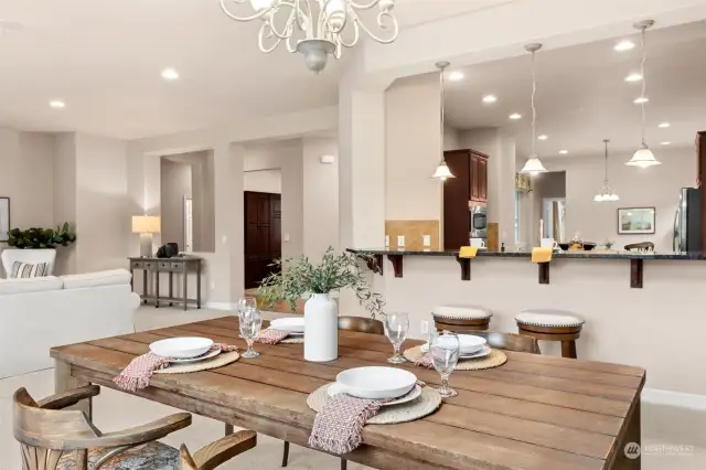 Living room/dining room with full bar space for entertaining. This home will also handle a Grand Piano!