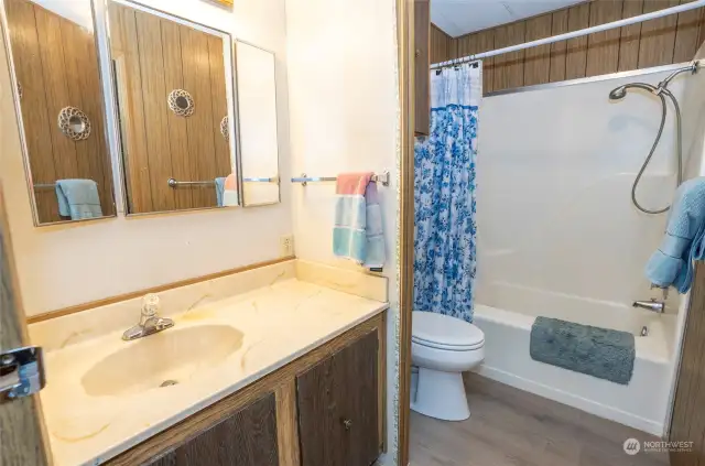 Spacious main guest bath with direct access to the second guest suite.