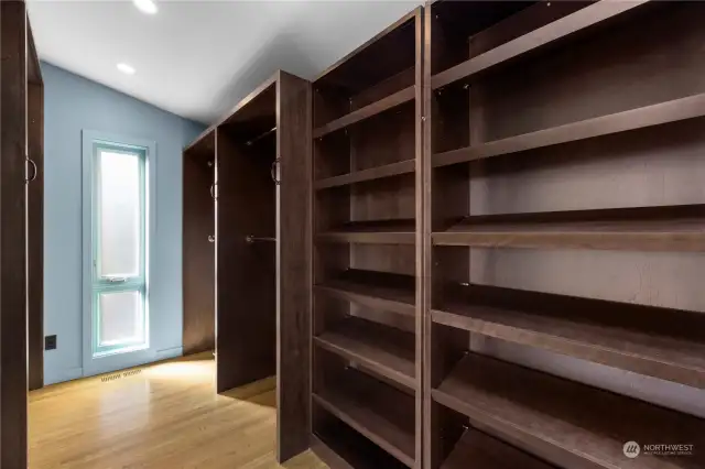 Primary bedroom walk-in closet.