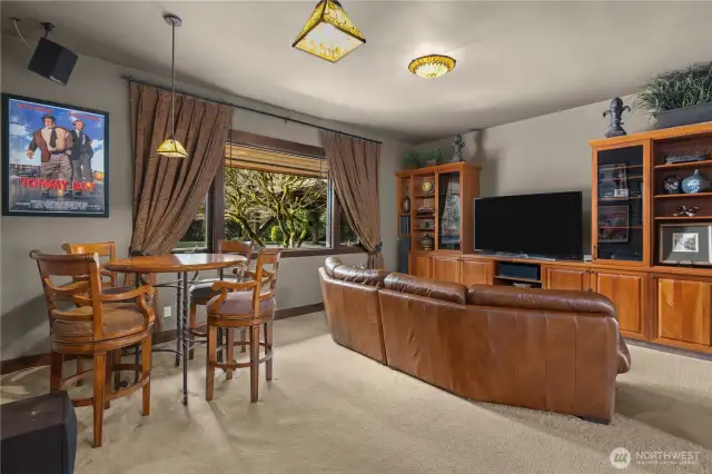 The media and game room is just off the kitchen. It is a cozy place to curl up or have a group of friends over.