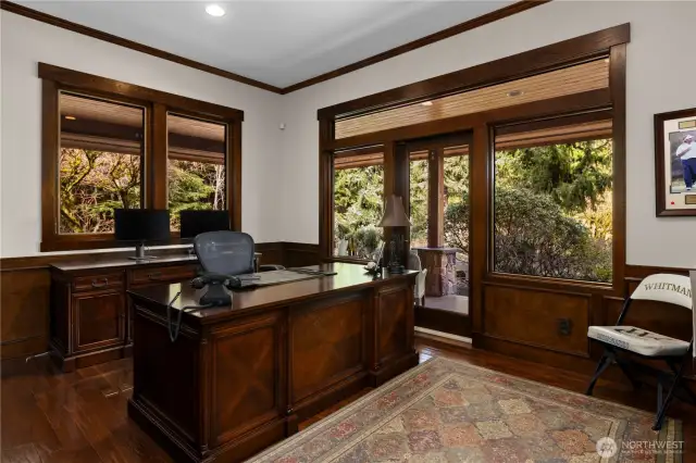 The wood paneled office sits on the northwest corner of the home. It enjoys a great view of Mt Si and a private veranda. Scotch anyone? More photos on the additional photo website link.