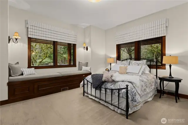Bedroom 5 is on the main level and has an ensuite full bathroom. The window seat has built-in storage. There is also a large closet. If anyone has mobility issues, this main floor bedroom is perfect. More photos of this room and bathroom on the additional photo website link.