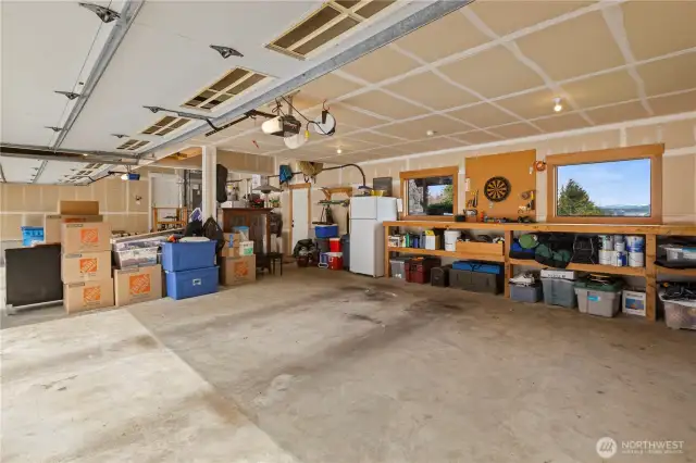The home has an attached 4-car garage with workshop space. In addition, there is a detached garage and carport.