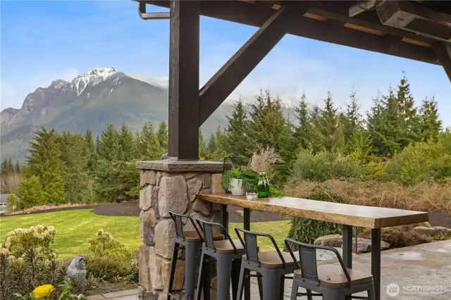 Entertain in style, no matter the season. The covered, heated patio offers seamless indoor-outdoor living, with wide French doors opening to breathtaking views. Watch the game, sip a Scotch by the fireplace, or host everything from intimate gatherings to lively celebrations—this home’s effortless flow is designed for it all. And best of all, it all comes with a spectacular view!