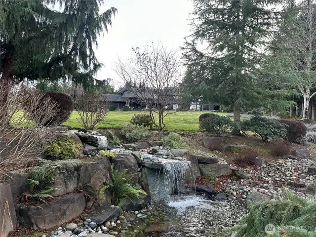 This 7+ acre bespoke estate welcomes you with the waterfall feature. It attracts deer and elk.